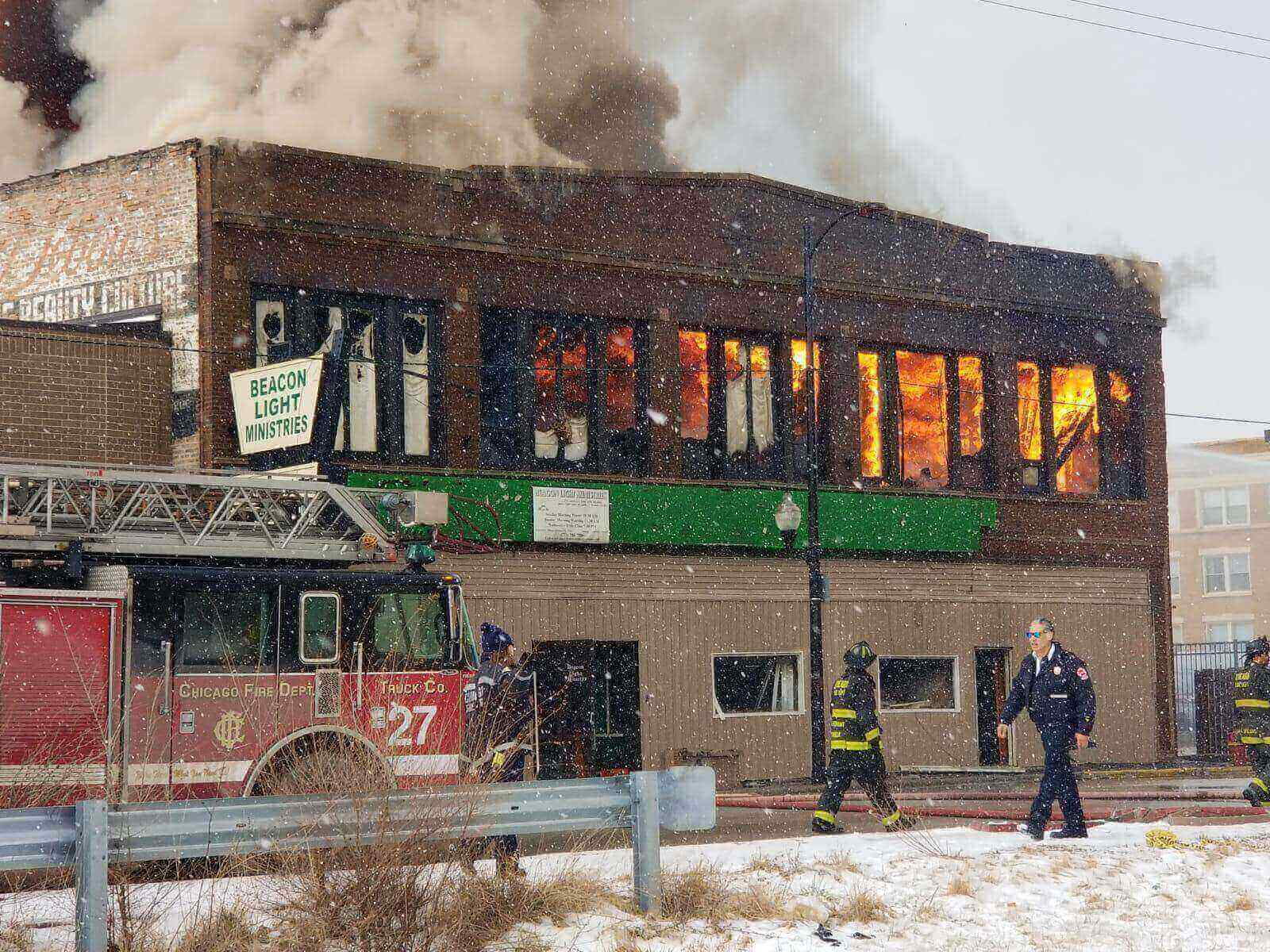 fireman arriving at a store building on fire