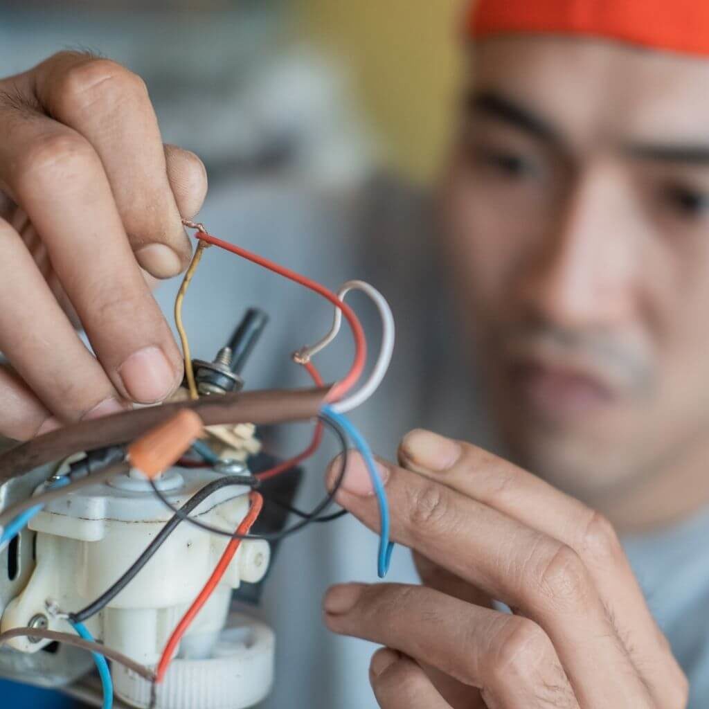 handyman restoring an appliace motor