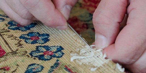 handyman restorating a carpet